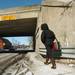 A pedestrian walks down State Street under the Stadium Blvd. bridge Wednesday afternoon, February 7, 2007 in Ann Arbor. Lon Horwedel, The Ann Arbor News